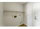 Utility room with essential hookups and ample space, facilitating easy laundry tasks at 8571 N 83Rd Dr, Peoria, AZ 85345