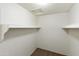 Walk-in closet with carpet and built-in shelving at 8571 N 83Rd Dr, Peoria, AZ 85345