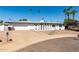 Beautiful single-story home featuring a two car garage and a desert landscape at 8714 E Mackenzie Dr, Scottsdale, AZ 85251