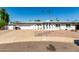 Beautiful single-story home with a two car garage and desert landscape at 8714 E Mackenzie Dr, Scottsdale, AZ 85251