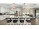Modern kitchen with stainless steel appliances, large island, and hardwood floors at 8714 E Mackenzie Dr, Scottsdale, AZ 85251