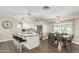 Modern kitchen with a large island, stainless steel appliances, and an adjacent dining area for Gathering meals at 8714 E Mackenzie Dr, Scottsdale, AZ 85251