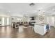 Spacious open floor plan with hardwood floors and a seamless flow to the kitchen at 8714 E Mackenzie Dr, Scottsdale, AZ 85251