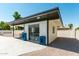 Charming pool house with a sliding glass door, offering a refreshing escape from the sun and poolside activities at 8714 E Mackenzie Dr, Scottsdale, AZ 85251