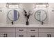 Bright bathroom features dual sinks, quartz countertops, modern lighting, and black hardware at 8941 E Maple Dr, Scottsdale, AZ 85255
