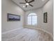Bright bedroom with vaulted ceilings, wood-look floors, and decorative art at 8941 E Maple Dr, Scottsdale, AZ 85255