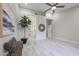 Spacious bedroom featuring wood-look floors, ample natural light, and a decorative mirror on the wall at 8941 E Maple Dr, Scottsdale, AZ 85255