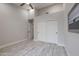 Large bedroom features wood-look floors, vaulted ceilings, closet, and ample natural light at 8941 E Maple Dr, Scottsdale, AZ 85255