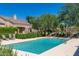 Sparkling community pool with ample seating and lush landscaping at 8941 E Maple Dr, Scottsdale, AZ 85255