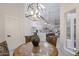 Bright dining area showcases modern light fixture and transitions into a well-appointed kitchen at 8941 E Maple Dr, Scottsdale, AZ 85255