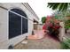 Exterior view with a patio area featuring colorful bougainvillea and natural desert landscaping at 8941 E Maple Dr, Scottsdale, AZ 85255