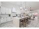 Bright modern kitchen with quartz counters, island seating, and stainless steel appliances at 8941 E Maple Dr, Scottsdale, AZ 85255