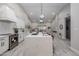 Bright, open kitchen features a large island with bar seating and modern appliances at 8941 E Maple Dr, Scottsdale, AZ 85255