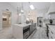 Open kitchen featuring white countertops, kitchen island, and stainless steel appliances at 8941 E Maple Dr, Scottsdale, AZ 85255