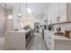 Spacious kitchen showcasing an island, stainless appliances, and white countertops with skylight at 8941 E Maple Dr, Scottsdale, AZ 85255