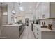 Modern kitchen with bright white cabinets, a large island, and an open floor plan at 8941 E Maple Dr, Scottsdale, AZ 85255