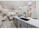 Open kitchen featuring an island, stainless steel appliances, and light colored flooring at 8941 E Maple Dr, Scottsdale, AZ 85255