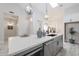 Kitchen island featuring white countertops, stainless steel appliances, and decorative accessories at 8941 E Maple Dr, Scottsdale, AZ 85255