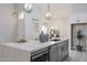 Kitchen island featuring stainless steel appliances and white countertops with decorative accessories at 8941 E Maple Dr, Scottsdale, AZ 85255