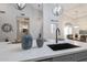 Kitchen island featuring stainless steel appliances, white countertops and decorative accessories at 8941 E Maple Dr, Scottsdale, AZ 85255