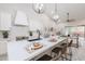 Bright, modern kitchen with quartz counters, island seating, and pendant lighting at 8941 E Maple Dr, Scottsdale, AZ 85255