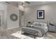 Well-lit bedroom featuring vaulted ceiling, accent wall decor, and a comfortable queen-sized bed at 8941 E Maple Dr, Scottsdale, AZ 85255