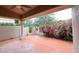 Charming outdoor patio area surrounded by lush landscaping and mature bougainvillea at 8941 E Maple Dr, Scottsdale, AZ 85255