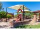 Community playground featuring slides and shaded play areas for enjoyment at 8941 E Maple Dr, Scottsdale, AZ 85255