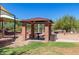 Community playground with picnic tables, covered seating, and desert landscaping at 8941 E Maple Dr, Scottsdale, AZ 85255