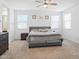Spacious primary bedroom with natural light and carpet flooring at 9310 W Atlantis Way, Tolleson, AZ 85353