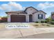 Charming single-story home with desert landscaping and a two-car garage at 9310 W Atlantis Way, Tolleson, AZ 85353
