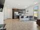Charming kitchen features stainless steel appliances, breakfast bar, and tile flooring at 9310 W Atlantis Way, Tolleson, AZ 85353