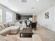Bright, open-concept living area flowing into a modern kitchen and dining space at 9310 W Atlantis Way, Tolleson, AZ 85353