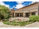 Private backyard oasis with a serene patio, lush landscaping, and beautiful flowering plants at 10511 N 87Th Way, Scottsdale, AZ 85258