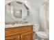 Bathroom featuring a vanity with marble countertop and decorative mirror, complemented by a tub with a shower at 10511 N 87Th Way, Scottsdale, AZ 85258