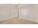 Carpeted bedroom with mirrored closet doors, providing convenient storage and a clean, modern look at 10511 N 87Th Way, Scottsdale, AZ 85258