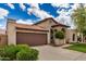 Beautiful front exterior with lush landscaping and a two-car garage at 10511 N 87Th Way, Scottsdale, AZ 85258
