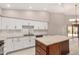 Kitchen features granite countertops, white cabinets, a center island, and stainless steel appliances at 10511 N 87Th Way, Scottsdale, AZ 85258