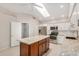 Kitchen featuring granite countertops, stainless steel appliances, an island and white cabinetry at 10511 N 87Th Way, Scottsdale, AZ 85258
