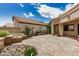 Inviting outdoor patio area featuring beautiful pavers and colorful landscaping at 10511 N 87Th Way, Scottsdale, AZ 85258