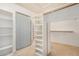 Spacious walk-in closet with ample shelving and closet rods for optimal organization and storage at 10511 N 87Th Way, Scottsdale, AZ 85258