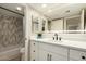 Bright bathroom features updated white vanity, modern fixtures, and a stylish tiled shower/tub at 11333 N 92Nd St # 2072, Scottsdale, AZ 85260