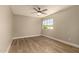 Empty bedroom features hardwood floors, ceiling fan and natural light from the window at 11333 N 92Nd St # 2072, Scottsdale, AZ 85260