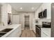 Bright kitchen with white cabinetry, stainless steel appliances, and a spacious pantry at 11333 N 92Nd St # 2072, Scottsdale, AZ 85260