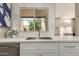 Stylish kitchen sink with quartz countertops and a view to the outside at 11333 N 92Nd St # 2072, Scottsdale, AZ 85260