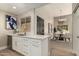 Modern kitchen featuring white cabinetry, quartz countertops, stylish backsplash, and stainless steel appliances at 11333 N 92Nd St # 2072, Scottsdale, AZ 85260