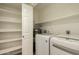 Laundry room features LG washer and dryer, shelving, and water heater at 11333 N 92Nd St # 2072, Scottsdale, AZ 85260