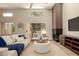 Open living room with fireplace, comfortable seating, and sliding glass doors at 11333 N 92Nd St # 2072, Scottsdale, AZ 85260