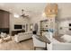 Open concept living and dining area with fireplace and bright natural light at 11333 N 92Nd St # 2072, Scottsdale, AZ 85260