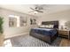 Comfortable main bedroom features a ceiling fan, window and stylish decor at 11333 N 92Nd St # 2072, Scottsdale, AZ 85260